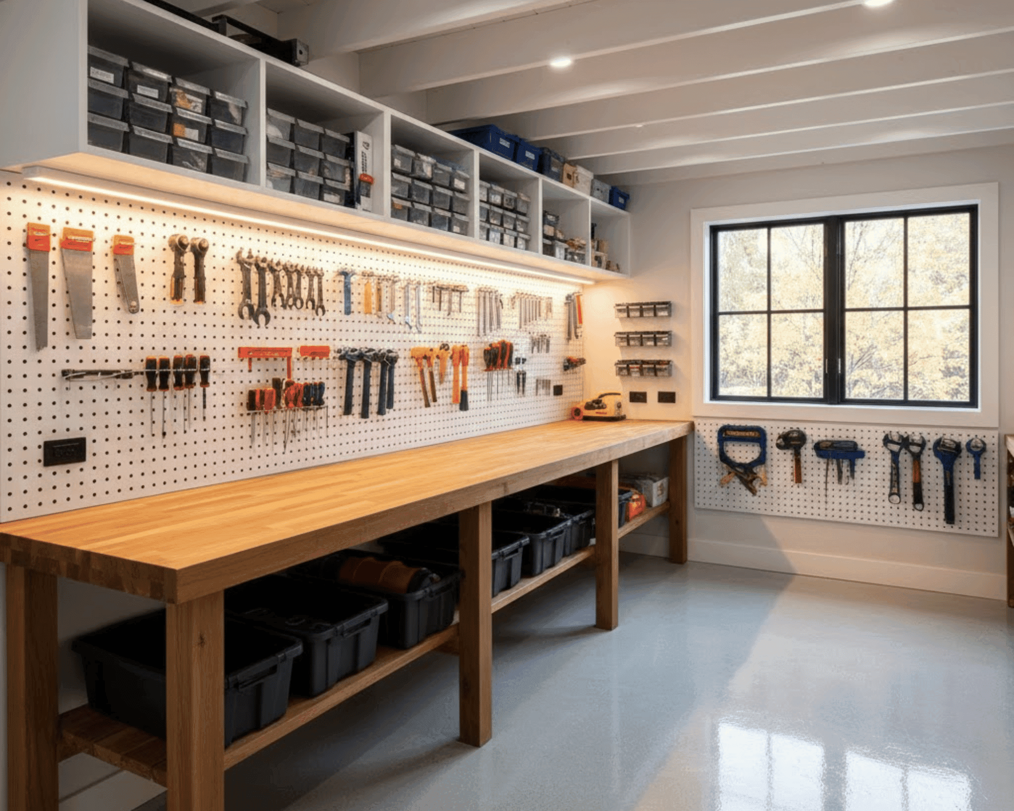 Organized workshop interior with pegboard tool storage and wood workbench